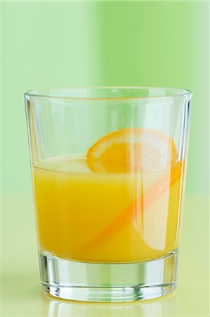 simsearch:659-06495307,k - A glass of orange juice with orange slices Stock Photo - Premium Royalty-Free, Code: 659-06152909