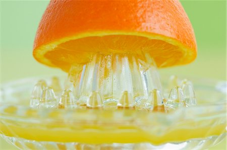 fruit close ups - An orange half on a juicer Stock Photo - Premium Royalty-Free, Code: 659-06152912