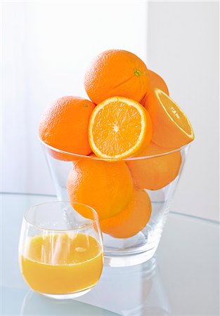 simsearch:659-06495307,k - A glass of orange juice and fresh oranges Stock Photo - Premium Royalty-Free, Code: 659-06153065