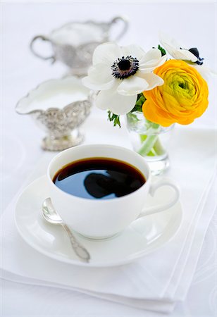 simsearch:659-06184015,k - A cup of coffee, milk, sugar and a bunch of flowers Stock Photo - Premium Royalty-Free, Code: 659-06153071