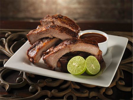 rib - Baby Back Ribs with Lime and Barbecue Sauce Foto de stock - Sin royalties Premium, Código: 659-06153159