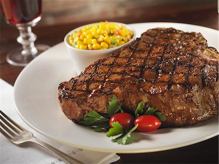 Grilled Porterhouse Steak with a Side of Corn Stock Photo - Premium Royalty-Free, Code: 659-06153163