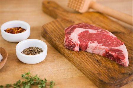 Steak with Tenderizer and Spices Stock Photo - Premium Royalty-Free, Code: 659-06153455