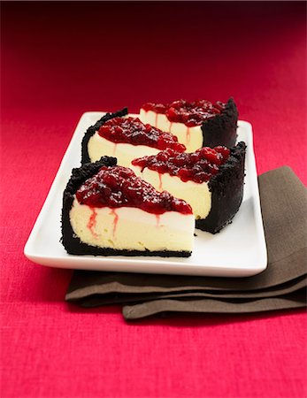 spinning top - Cheese cake with sour cream, chocolate crust and cherry topping Stock Photo - Premium Royalty-Free, Code: 659-06153496