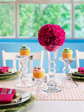 A festively laid table with flower balls and cupcakes Stock Photo - Premium Royalty-Free, Code: 659-06153508