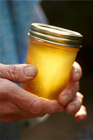 simsearch:659-07027183,k - Hands Holding a Jar of Honey Stock Photo - Premium Royalty-Free, Code: 659-06153930