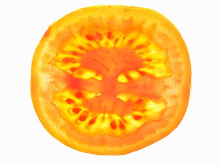 simsearch:659-07026815,k - A tomato slice, lit from behind Foto de stock - Sin royalties Premium, Código: 659-06184411