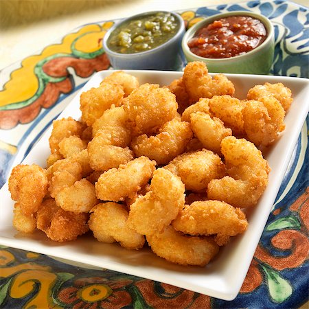 seafood - Fried Breaded Shrimp with Chili Sauce and Tomatillo Salsa Stock Photo - Premium Royalty-Free, Code: 659-06184675