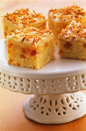 Apricot and coconut slices on a cake stand Stock Photo - Premium Royalty-Free, Code: 659-06184814