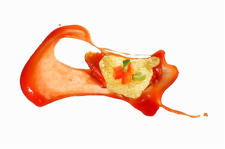 snack - A taco squirted with tomato sauce Stock Photo - Premium Royalty-Free, Code: 659-06184948