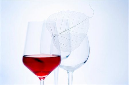 simsearch:659-06186663,k - Glass of red wine and empty wine glasses Stock Photo - Premium Royalty-Free, Code: 659-06184999