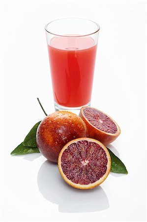 simsearch:659-06495307,k - Squeezer on sliced blood orange and glass of juice Stock Photo - Premium Royalty-Free, Code: 659-06185067