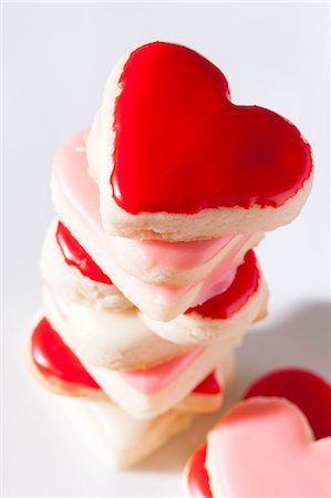 simsearch:659-06373404,k - Iced heart-shaped biscuits, stacked Stock Photo - Premium Royalty-Free, Code: 659-06185111