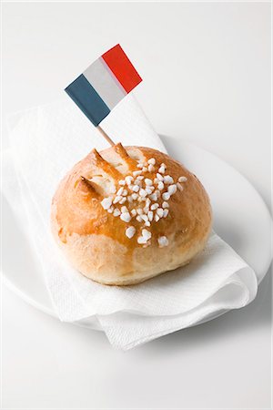 Milk roll with sugar and French flag Stock Photo - Premium Royalty-Free, Code: 659-06185343