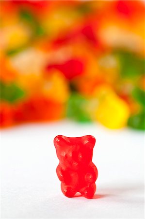 simsearch:659-06151276,k - Red Gummie Bear; Many Gummie Bears in Background Stock Photo - Premium Royalty-Free, Code: 659-06185885