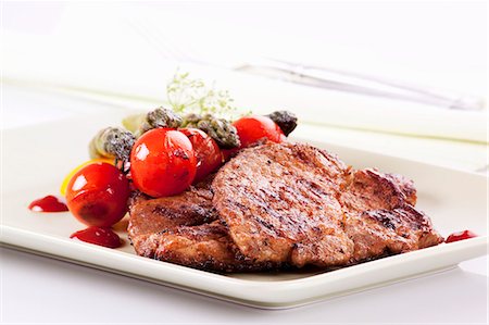 Grilled pork collar steak with a side of vegetables Stock Photo - Premium Royalty-Free, Code: 659-06186182