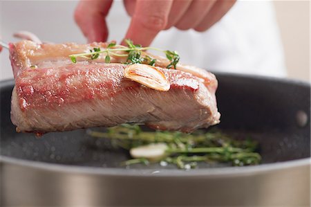simsearch:659-06186142,k - Rack of lamb with thyme and garlic Stock Photo - Premium Royalty-Free, Code: 659-06186384