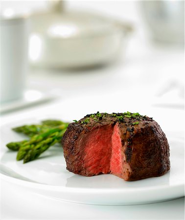 Beef Filet Cooked Rare with Slice Removed; Served with Asparagus Stock Photo - Premium Royalty-Free, Code: 659-06186446