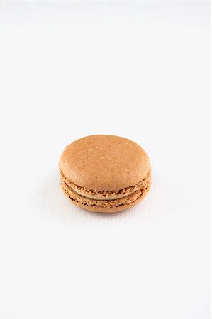 A Single Earl Grey Macaroon on a White Background Stock Photo - Premium Royalty-Free, Code: 659-06186535