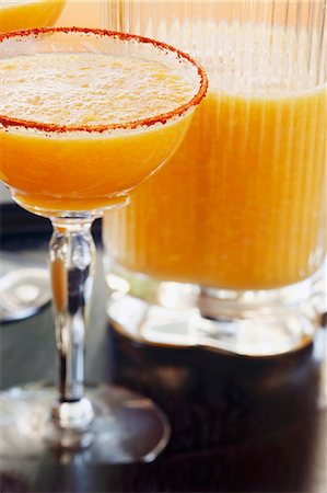 Mango Margarita with Grapefruit Soda and Chili Encrusted Glass Rim Stock Photo - Premium Royalty-Free, Code: 659-06186549