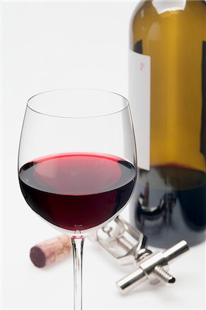 simsearch:659-06186663,k - A glass of red wine, cork, corkscrew and bottle of red wine Stock Photo - Premium Royalty-Free, Code: 659-06186660