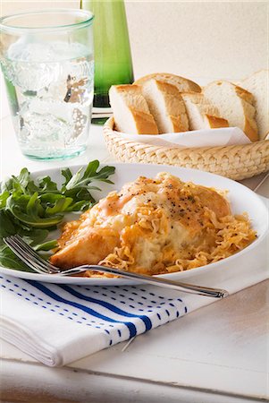 reuben sandwich - Ruben Style Baked Chicken with Arugula; Basket of Bread Stock Photo - Premium Royalty-Free, Code: 659-06186681