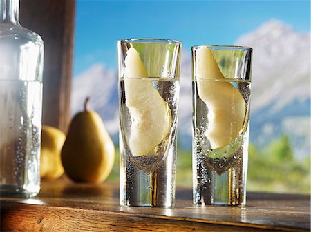 Two glasses of William's pear schnapps against an alpine backdrop Stock Photo - Premium Royalty-Free, Code: 659-06187079