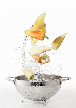 simsearch:659-06154334,k - Hungarian peppers with a water splash and a colander Stock Photo - Premium Royalty-Free, Code: 659-06187143