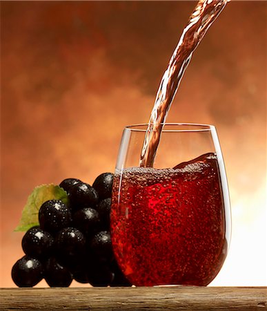 red grape - Pouring grape juice into a glass Stock Photo - Premium Royalty-Free, Code: 659-06187650