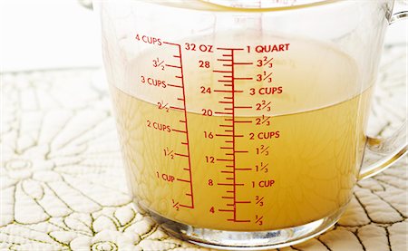 2 1/2 Cups of Chicken Broth in a Measuring Cup Stock Photo - Premium Royalty-Free, Code: 659-06187769