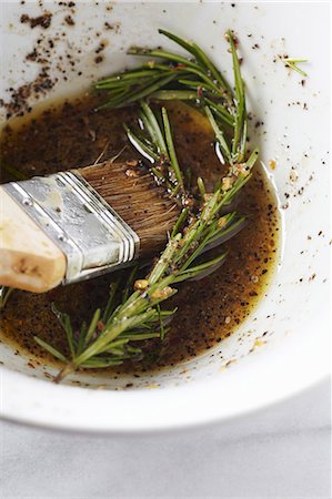 Rosemary Marinade in a Bowl with a Basting Brush Stock Photo - Premium Royalty-Free, Code: 659-06187785