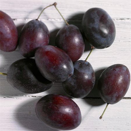 simsearch:659-06373112,k - Several plums on a white wood surface Stock Photo - Premium Royalty-Free, Code: 659-06188047