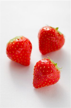 strawberries - Three strawberries Stock Photo - Premium Royalty-Free, Code: 659-06188278