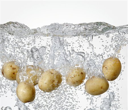 raw potato - Potatoes in boiling water Stock Photo - Premium Royalty-Free, Code: 659-06183765