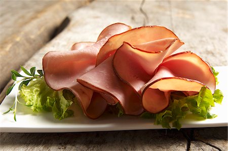Open face sandwich with turkey ham and Lollo Bianco Stock Photo - Premium Royalty-Free, Code: 659-06306353