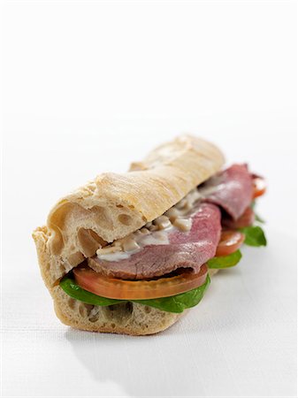 filled - Baguette sandwich with roast beef and tomatoes Stock Photo - Premium Royalty-Free, Code: 659-06306377