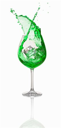 simsearch:659-01850296,k - An ice cube falling into a green cocktail Stock Photo - Premium Royalty-Free, Code: 659-06306558