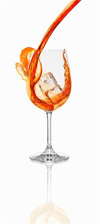 simsearch:659-01850296,k - Aperol being poured into a glass with an ice cube Stock Photo - Premium Royalty-Free, Code: 659-06306550