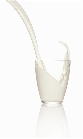 Pouring milk into a glass Stock Photo - Premium Royalty-Free, Code: 659-06306562