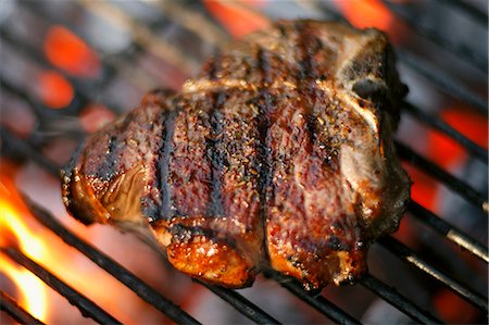 Lamb Chop Cooking on a Charcoal Grill Stock Photo - Premium Royalty-Free, Code: 659-06306596