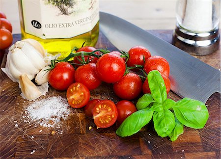 food still life - Cherry tomatoes, basil, salt, garlic and olive oil Stock Photo - Premium Royalty-Free, Code: 659-06306818