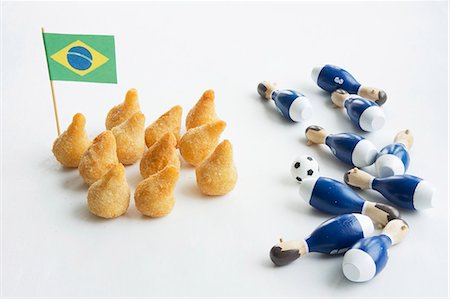 Salgadinhos with a Brazilian flag and football decorations Stock Photo - Premium Royalty-Free, Code: 659-06307165