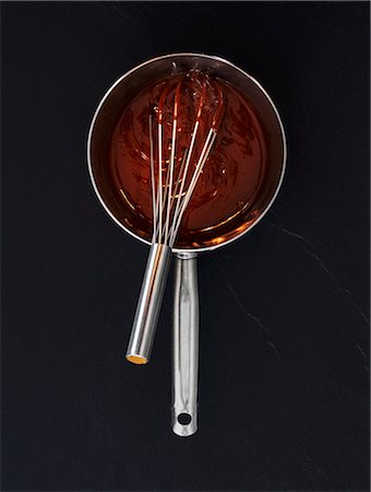 preparation - Liquid chocolate in a saucepan with a whisk (seen from above) Stock Photo - Premium Royalty-Free, Code: 659-06307520