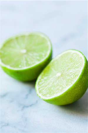 A halved lime Stock Photo - Premium Royalty-Free, Code: 659-06307523