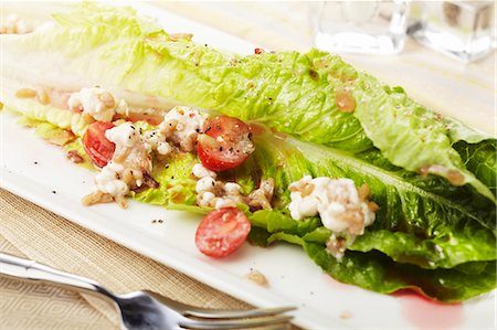 Romain Lettuce Salad with Feta Cheese, Tomato and Vinaigrette Dressing Stock Photo - Premium Royalty-Free, Code: 659-06372388