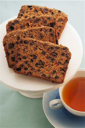 Spiced raisin cake with a cup of tea Stock Photo - Premium Royalty-Free, Code: 659-06372528
