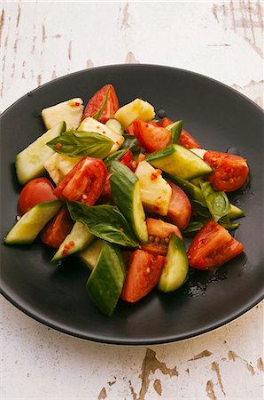 simsearch:659-06373046,k - Tomato and cucumber salad with pineapple and basil Stock Photo - Premium Royalty-Free, Code: 659-06372536