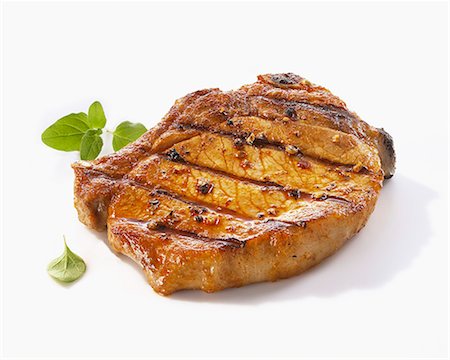 porkchop - A grilled pork chop Stock Photo - Premium Royalty-Free, Code: 659-06372557