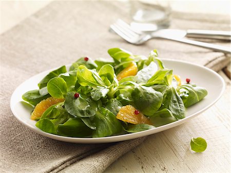 salad images - Lamb's leaf lettuce with orange wedges Stock Photo - Premium Royalty-Free, Code: 659-06372726