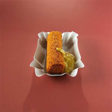 A meat croquette with sweet mustard (Holland) Stock Photo - Premium Royalty-Free, Code: 659-06372857